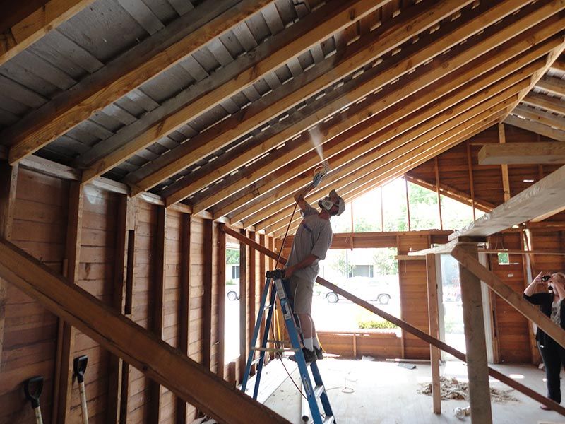 Contractor applying Radiant X to roof decking